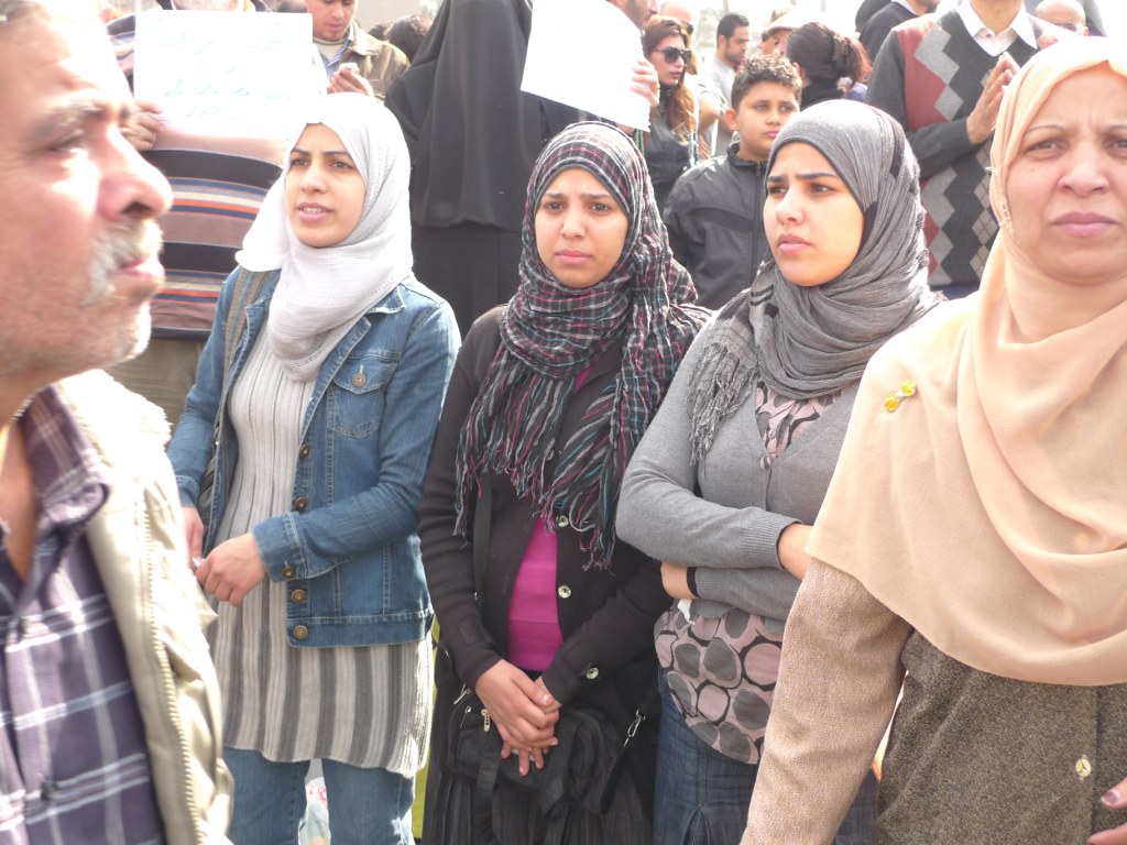Egyptian women stand together in Tahrir square in 2011